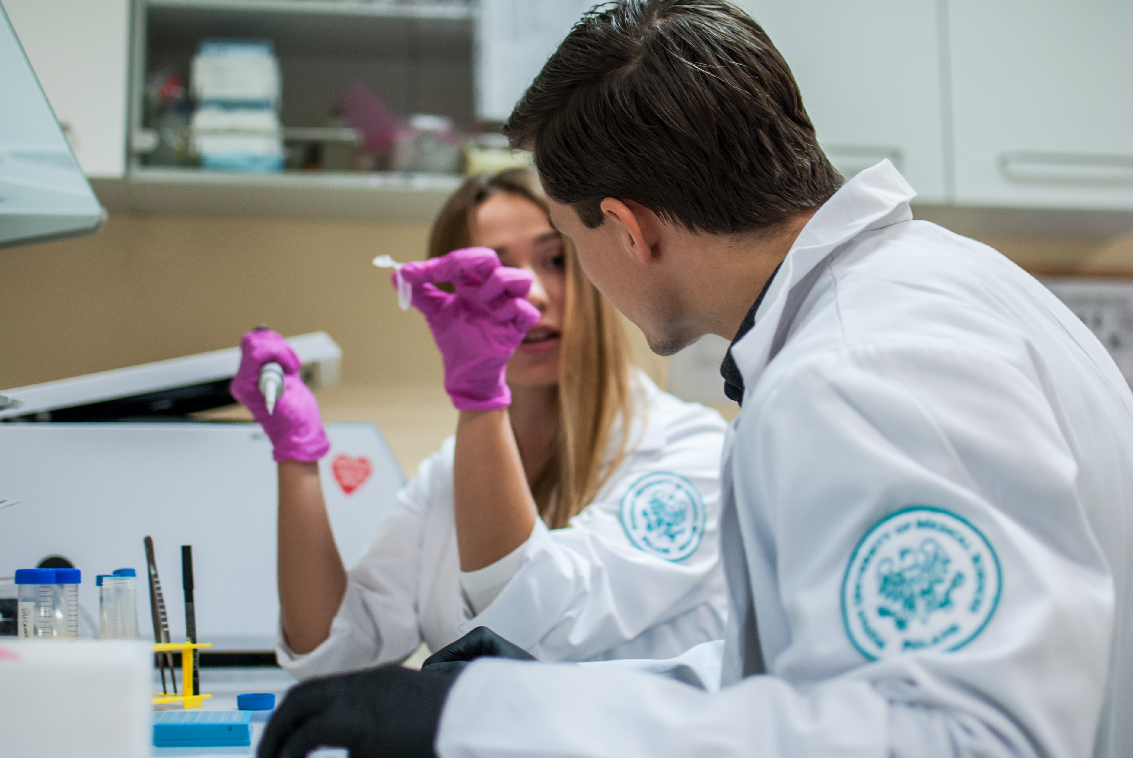 Photo of two lab workers